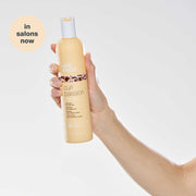 milk-shake-curl-passion-shampoo-in-hand